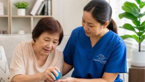 Assisting Hands Caregiver does therapy sessions with a stroke survivor senior woman 