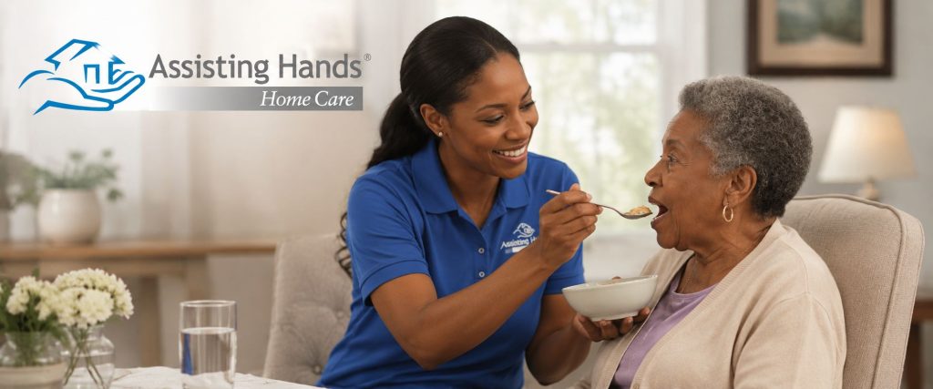 Assisting Hands Caregiver Feeding Food to Senior Woman