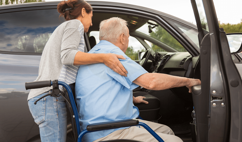 transportation Caregiver helping man with transportation