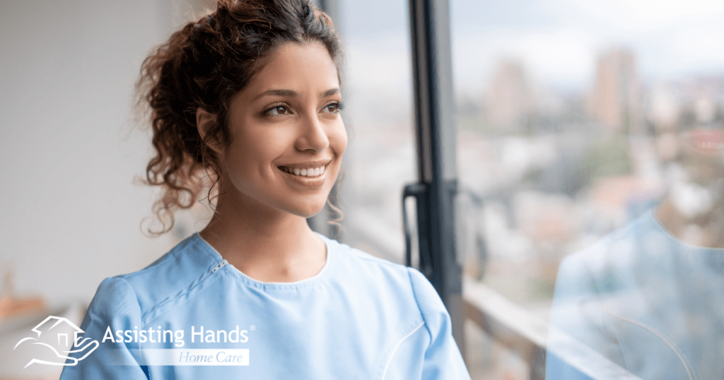 A woman hopefully and happily looks toward her future in the home care industry.