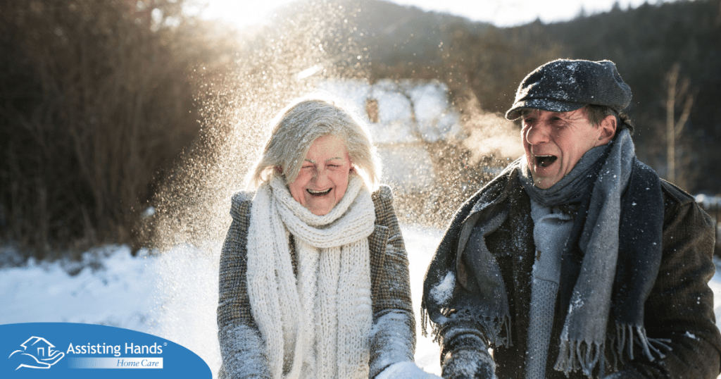 As a result of good winter safety practices, an elderly couple can enjoy time outside in the snow.