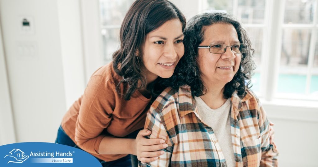 A woman hugs her older mother, representing compassionate senior care