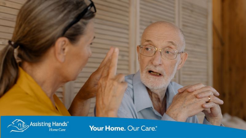 Caregiver assisting Parkinson’s patient with communication