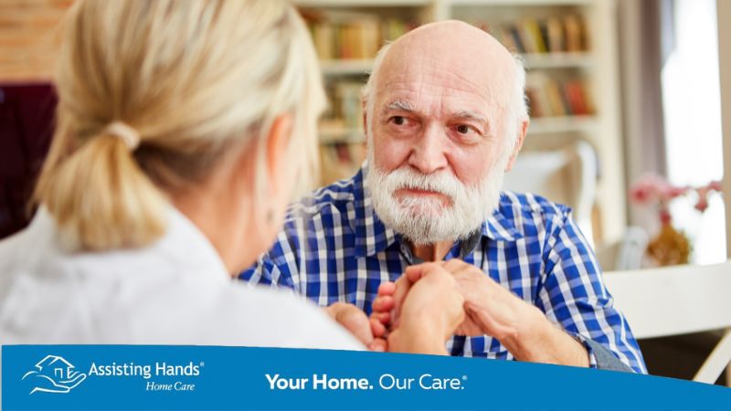 Family member supporting a loved one showing early signs of Alzheimer’s