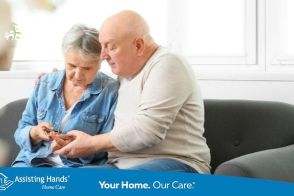 family caregiver checking senior woman's diabetes