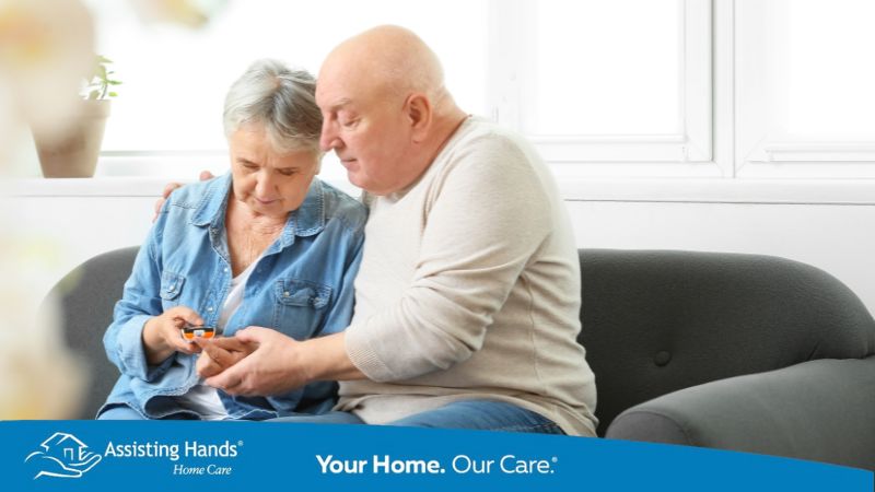 family caregiver checking senior woman's diabetes