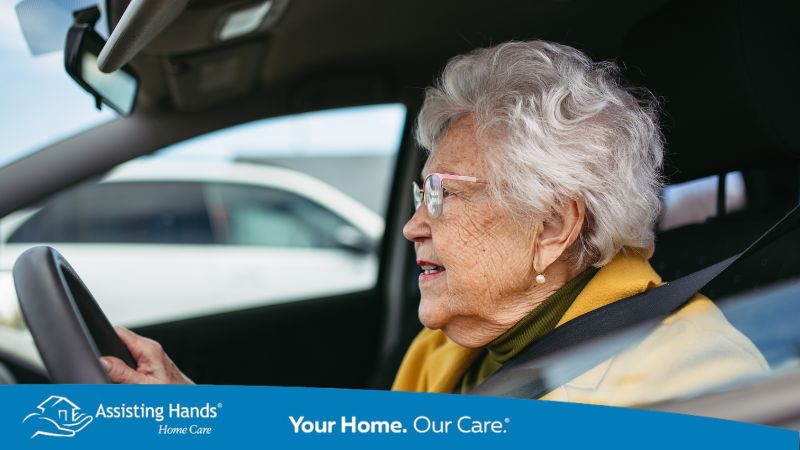 senior woman driving the car and struggling to use the steering wheel