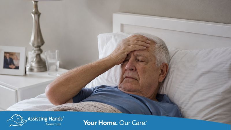 Senior man recovering from a stroke resting in bed at home, showing signs of post-stroke fatigue