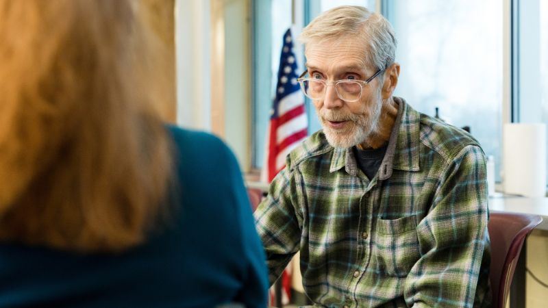 veteran senior talking to a home care provider