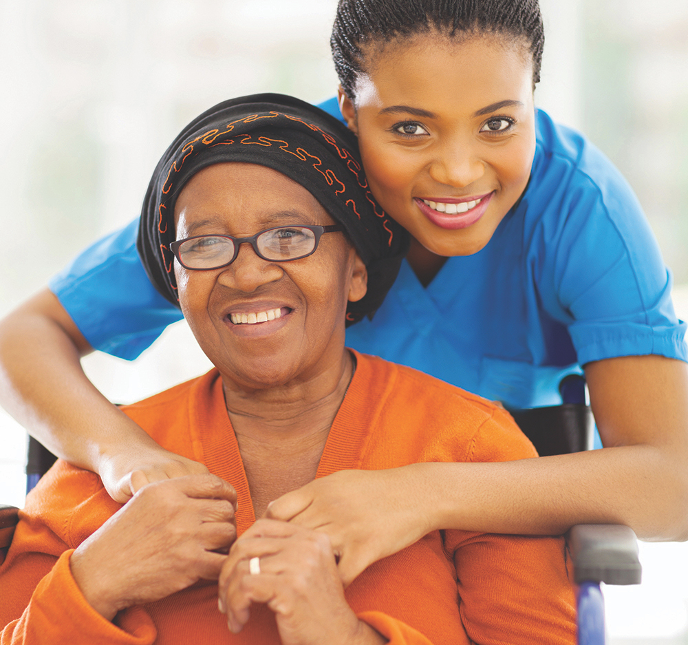portrait of senior african disabled woman and her caregiver