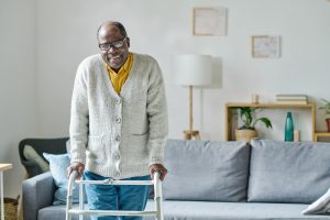 senior smiling while using walker