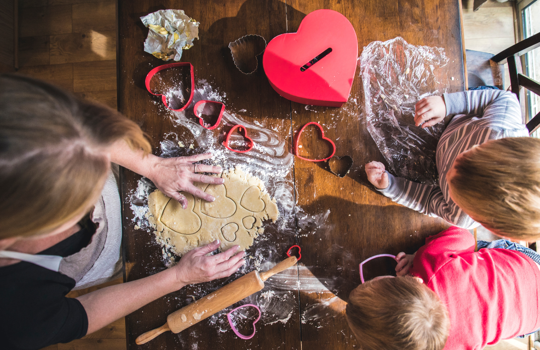 baking valentines day cookies with family